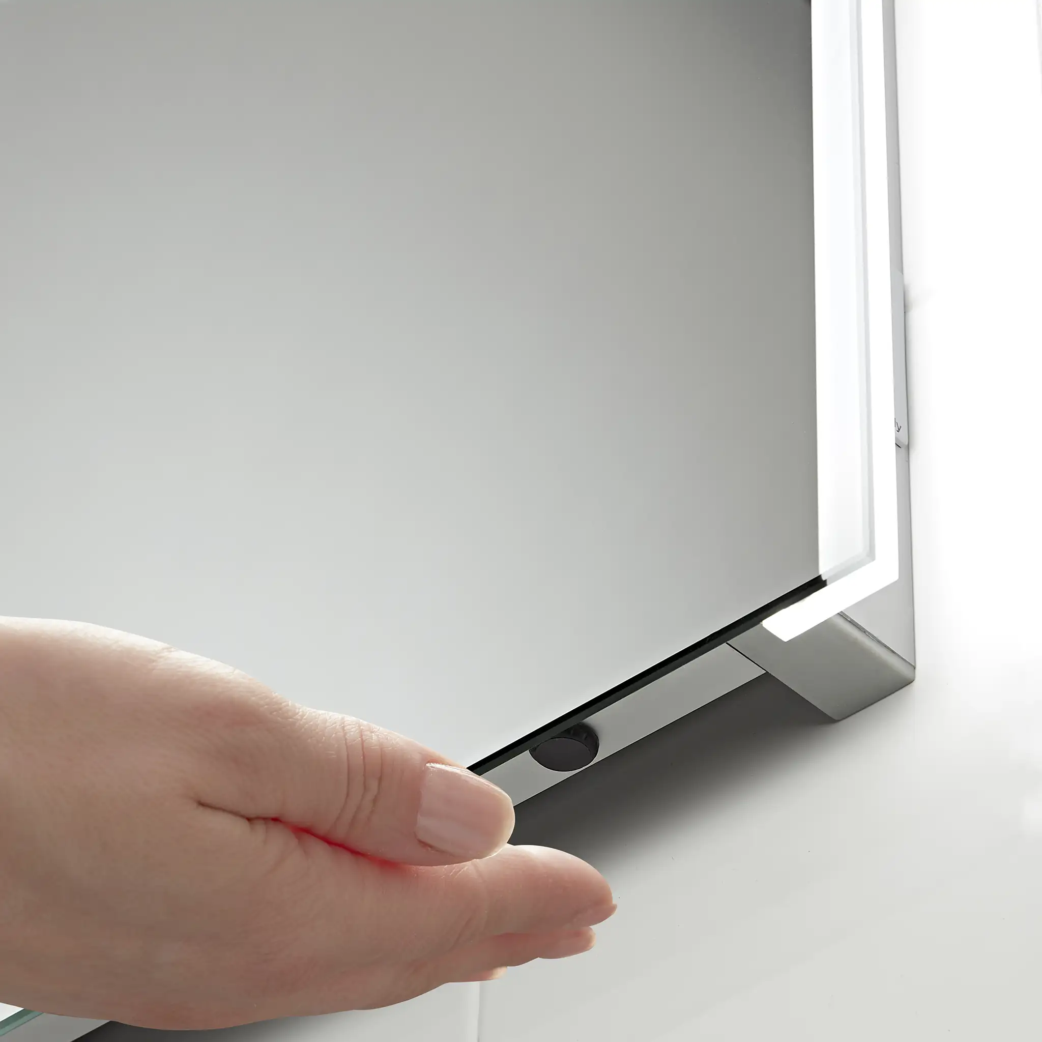 Bathroom mirror with sensor control